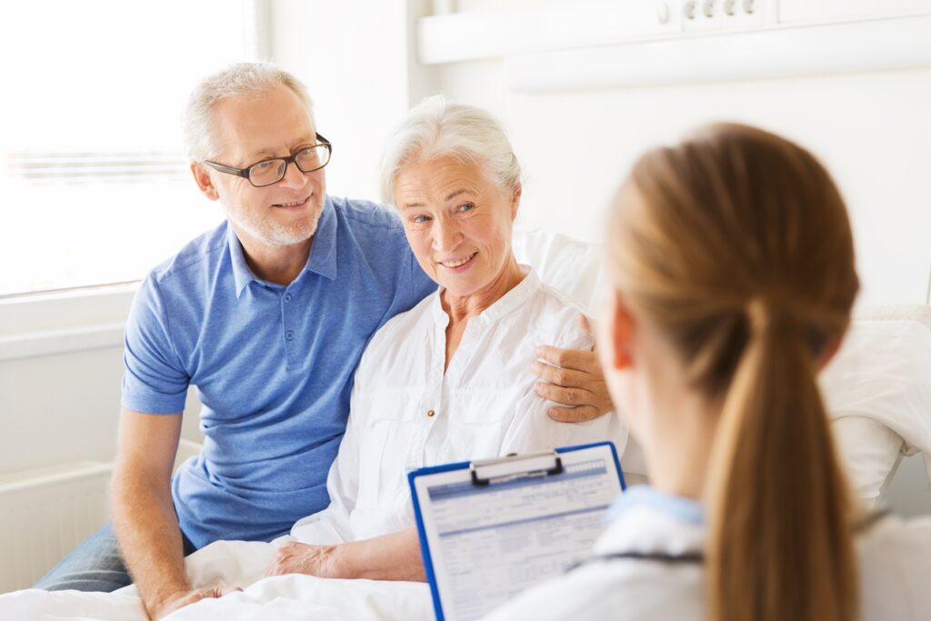 Senior couple with doctor during consultation.