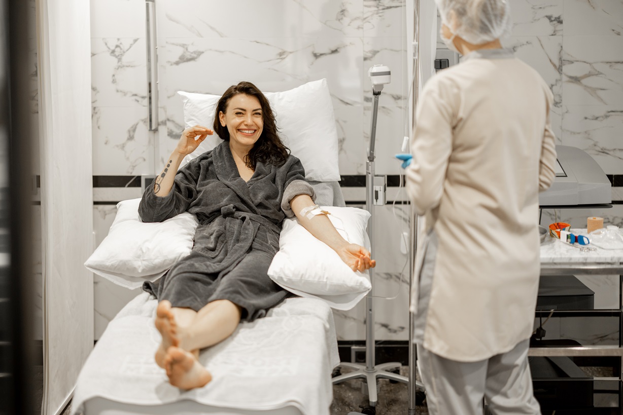 Woman relaxing during IV vitamin drip.