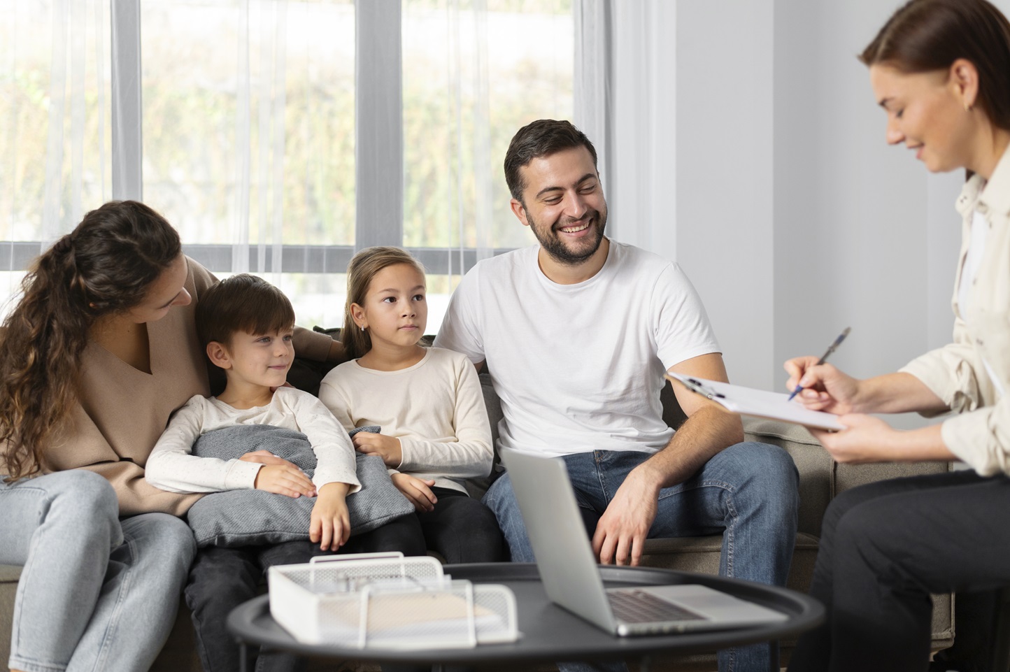 Family in therapy session with counselor.