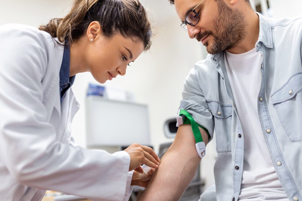 A doctor and a patient are examining their blood pressure.