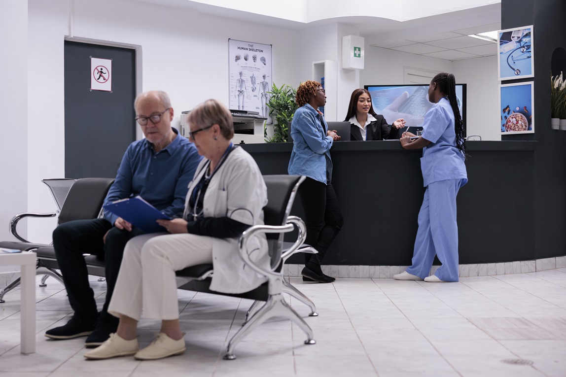 Patients waiting in a hospital lobby.