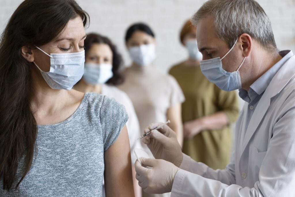 Woman receiving COVID-19 vaccination.