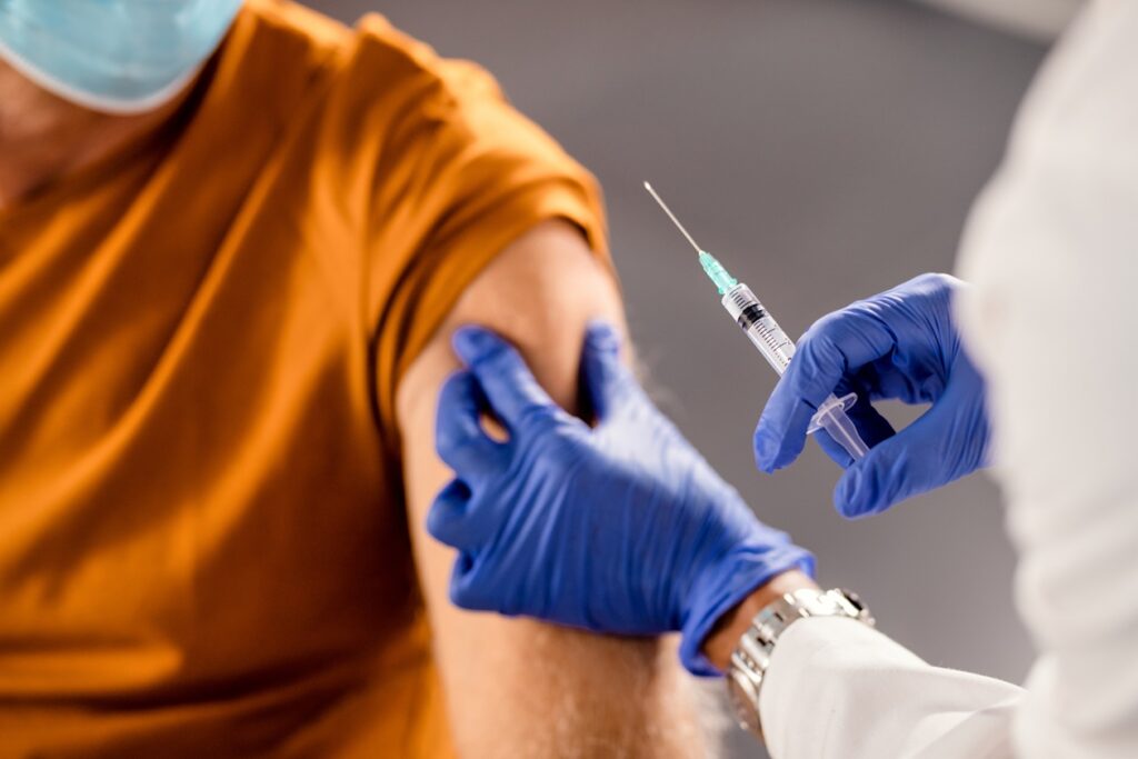 Man receiving a vaccine injection.